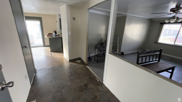 2491 Highway 89, Unit 114 Pleasant View, UT 84404 - Photo 2 of 18 Hallway featuring arched walkways and baseboards