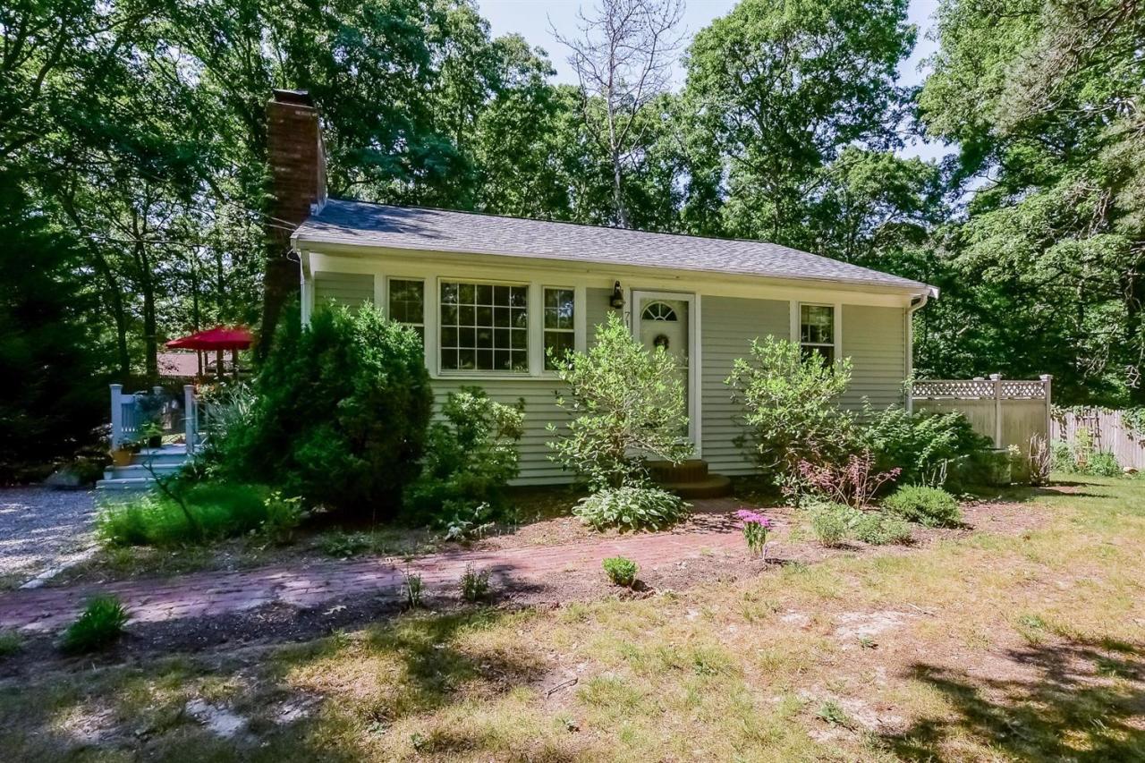 71 Wakeby Road Marstons Mills, MA 02648 - Photo 1 of 31 a front view of a house with garden