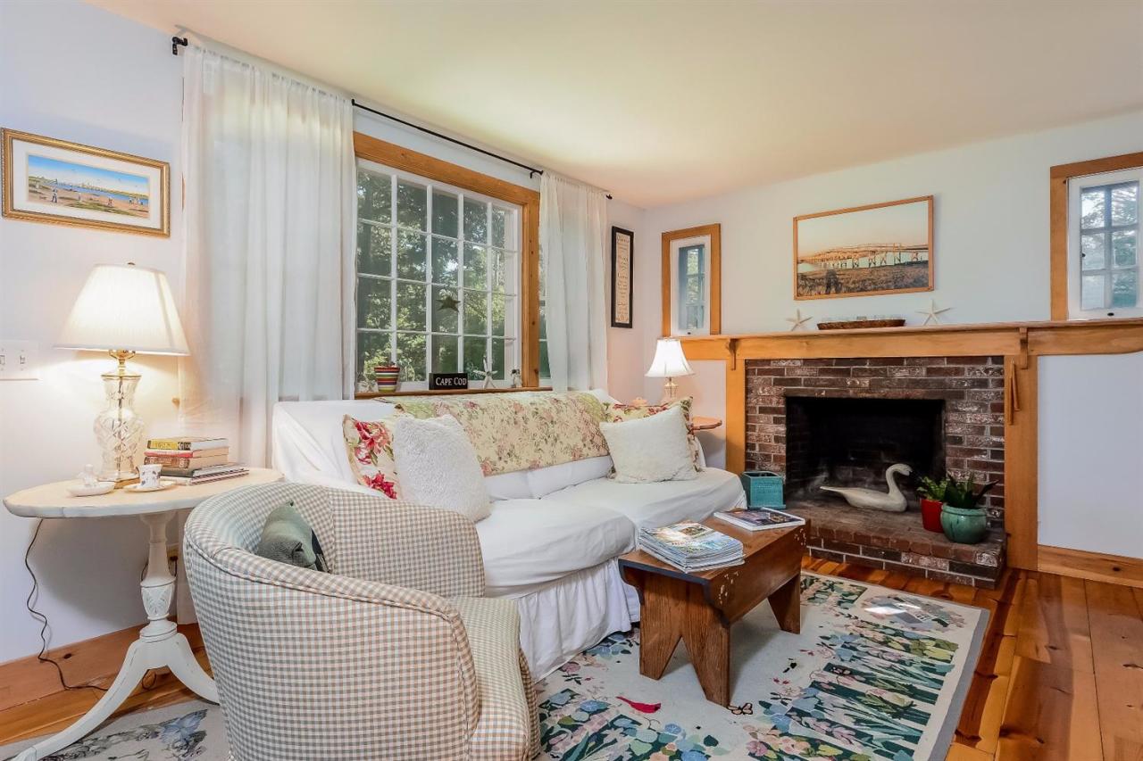 71 Wakeby Road Marstons Mills, MA 02648 - Photo 13 of 31 a living room with furniture fireplace and window