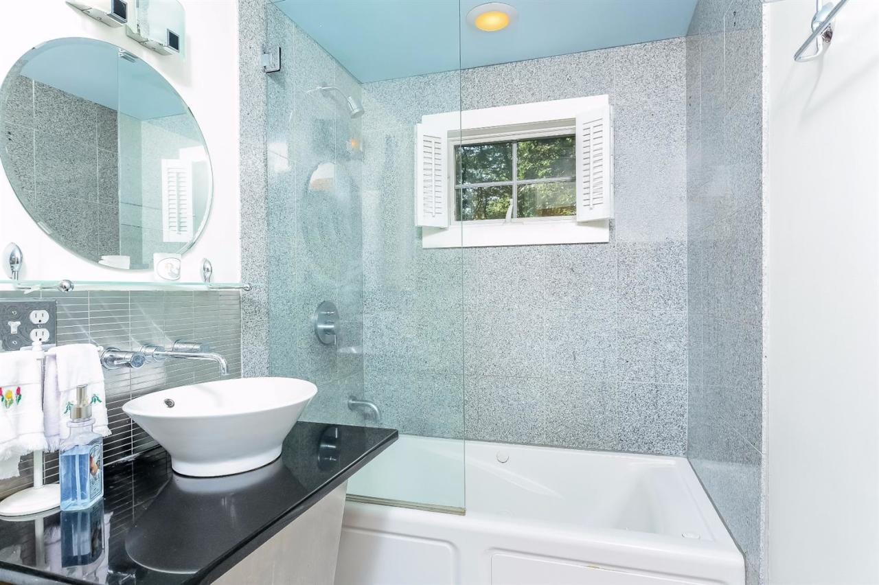 71 Wakeby Road Marstons Mills, MA 02648 - Photo 15 of 31 a bathroom with a sink and a mirror