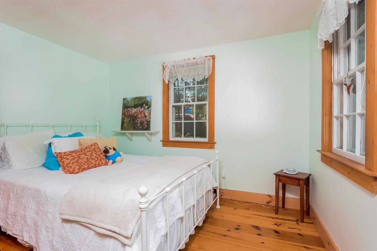 71 Wakeby Road Marstons Mills, MA 02648 - Photo 18 of 31 a bedroom with a bed and a window