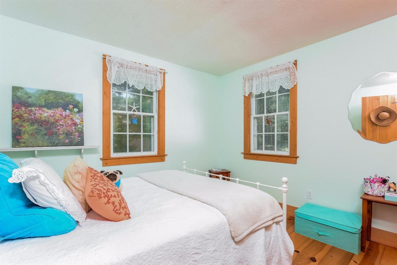 71 Wakeby Road Marstons Mills, MA 02648 - Photo 19 of 31 a bedroom with a bed and a window