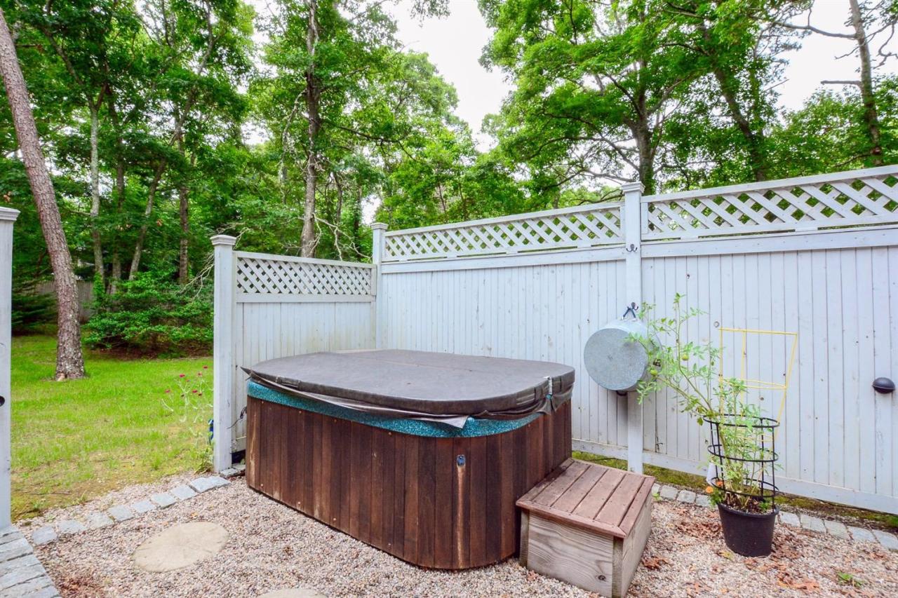 71 Wakeby Road Marstons Mills, MA 02648 - Photo 24 of 31 a view of a backyard with a tub and trees