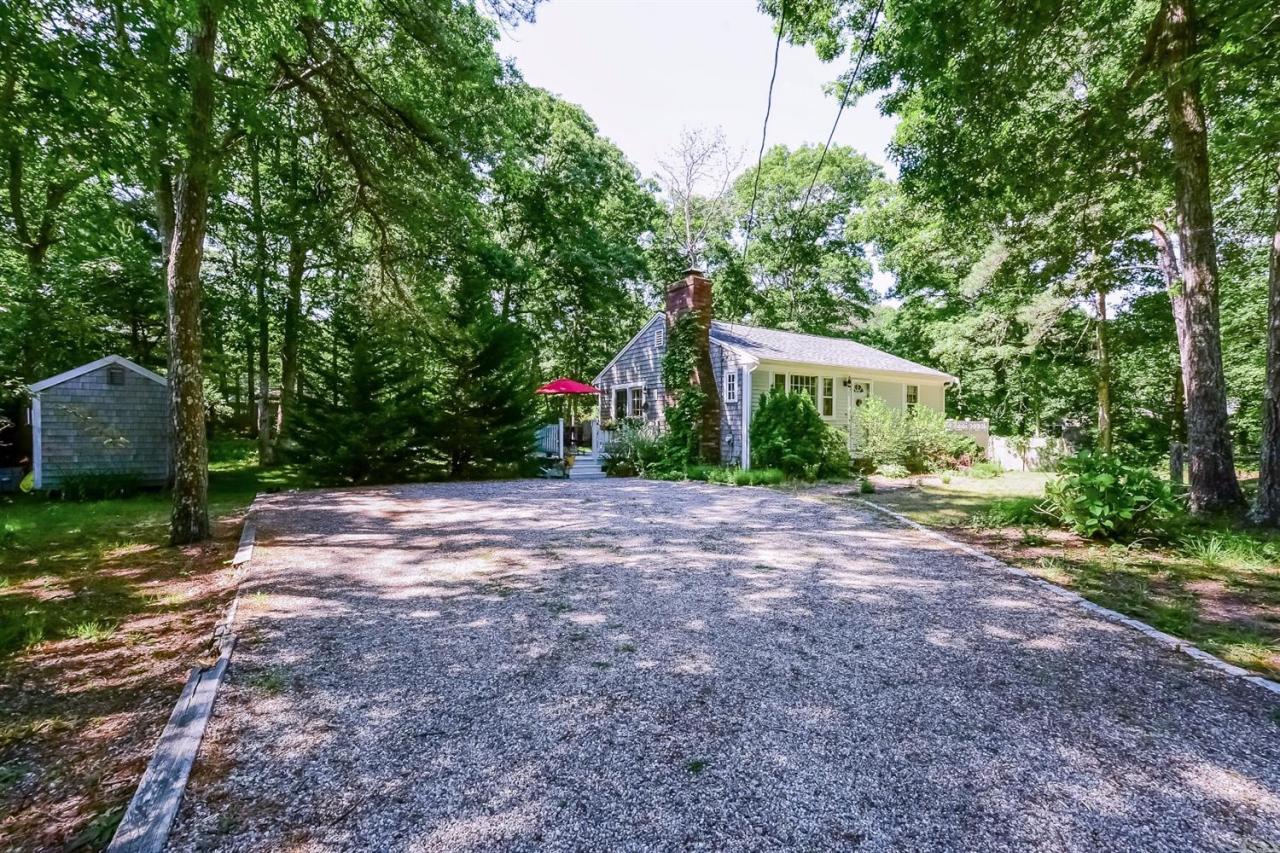 71 Wakeby Road Marstons Mills, MA 02648 - Photo 26 of 31 a view of a house with backyard and trees