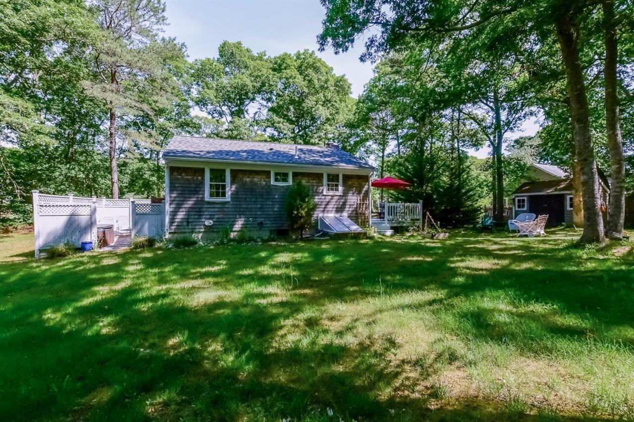 71 Wakeby Road Marstons Mills, MA 02648 - Photo 3 of 31 a view of a house with backyard and a tree