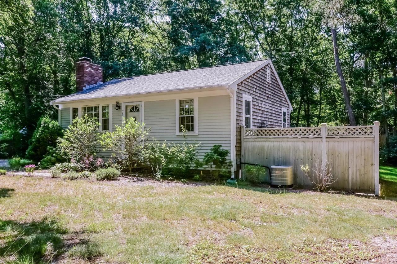 71 Wakeby Road Marstons Mills, MA 02648 - Photo 31 of 31 a front view of a house with garden