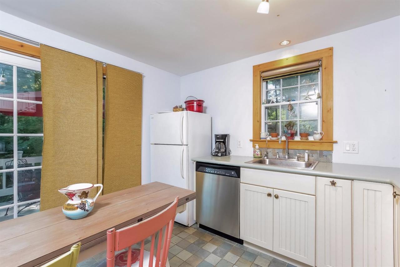 71 Wakeby Road Marstons Mills, MA 02648 - Photo 8 of 31 a kitchen that has a sink and a refrigerator