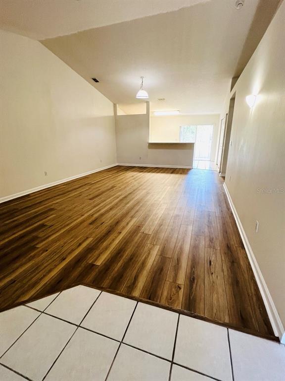 78 Plainview Drive, Unit B Palm Coast, FL 32164 - Photo 3 of 7 a view of a room with wooden floor
