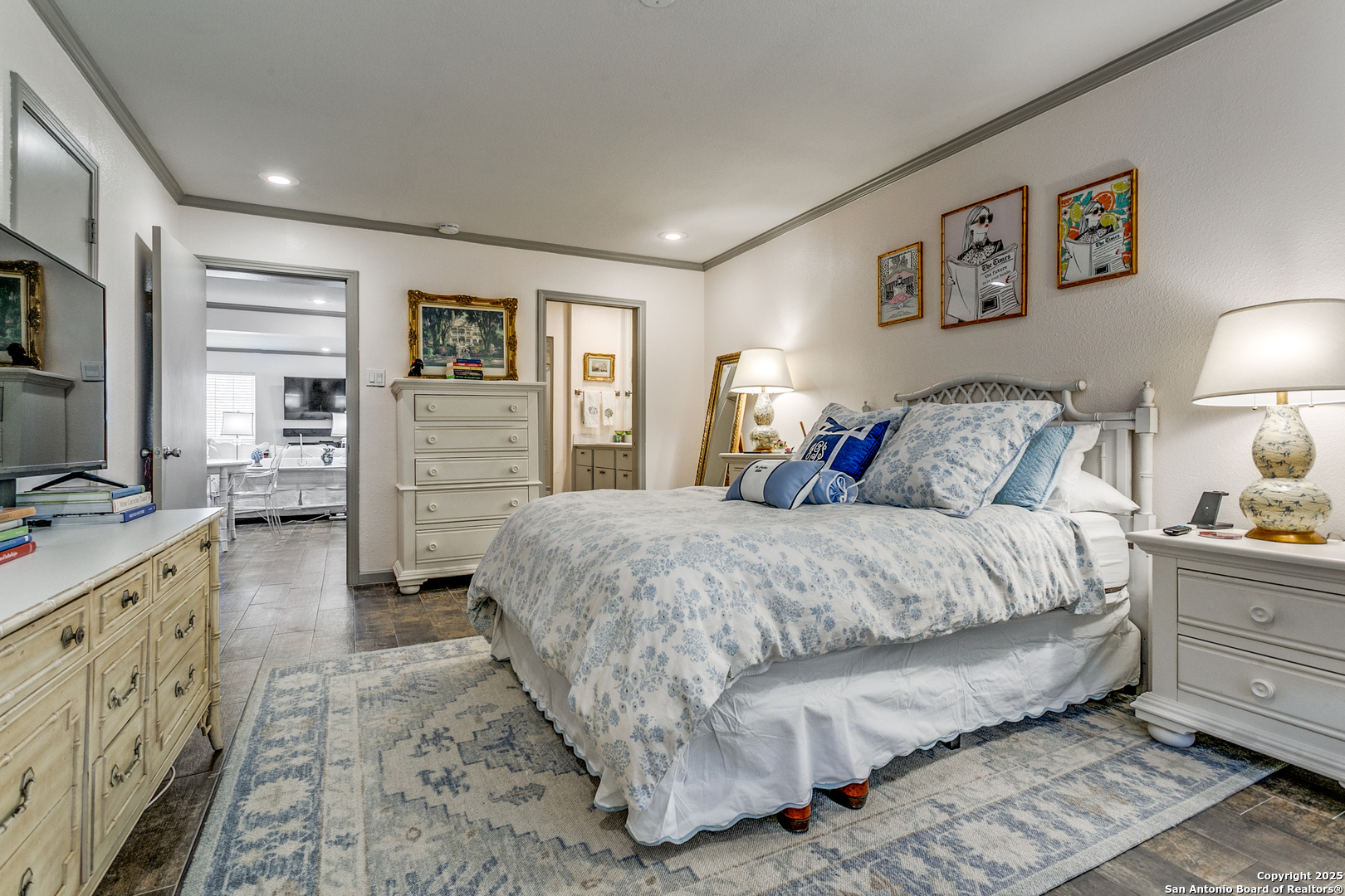 109 Ruelle Lane, Unit 109A San Antonio, TX 78209 - Photo 17 of 23 a spacious bedroom with a bed and wooden floor