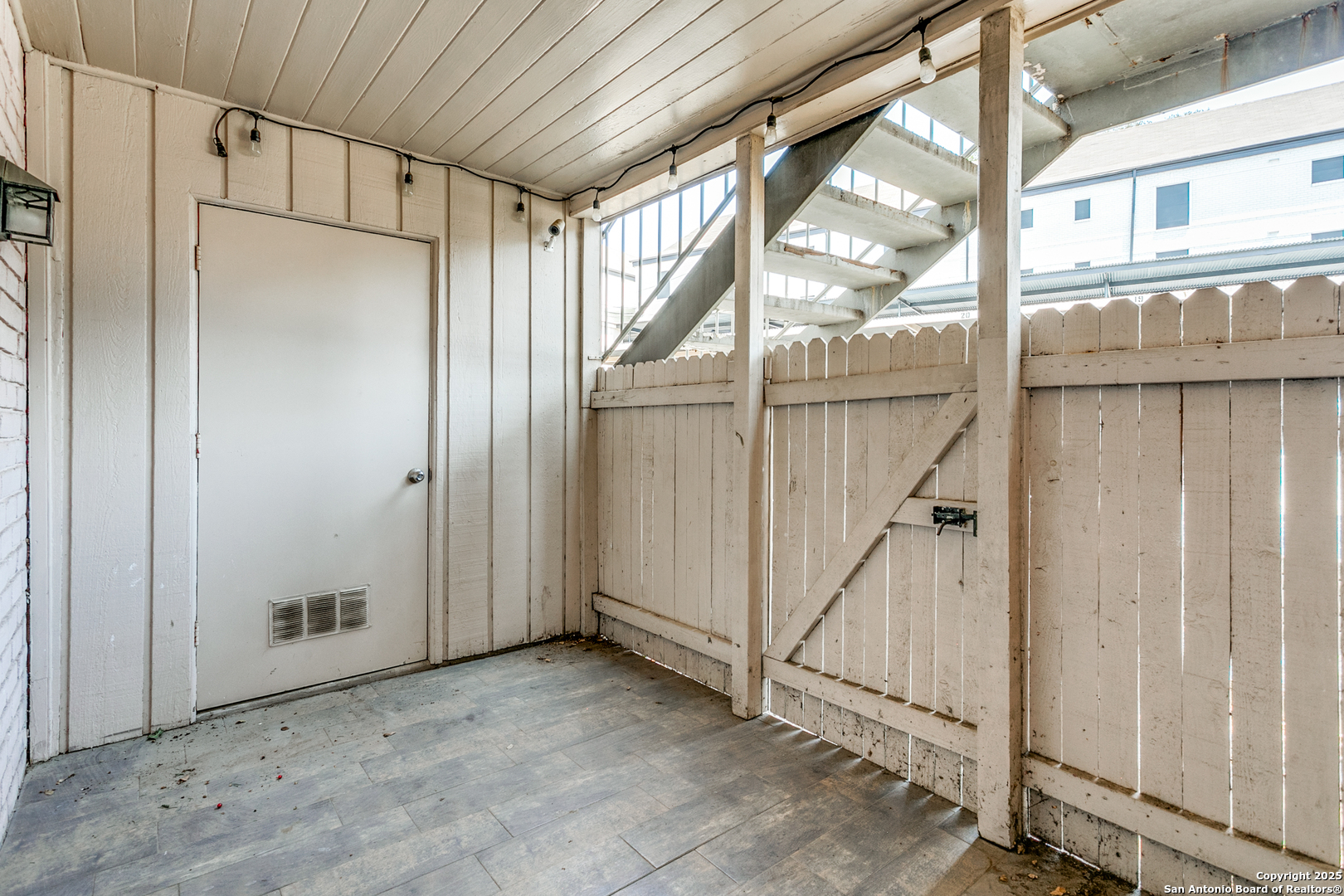 109 Ruelle Lane, Unit 109A San Antonio, TX 78209 - Photo 20 of 23 a view of an empty room with a window