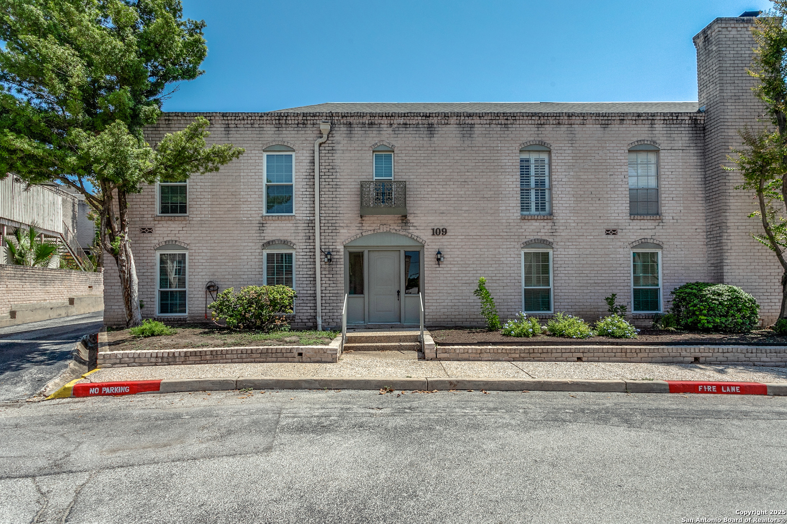 109 Ruelle Lane, Unit 109A San Antonio, TX 78209 - Photo 3 of 23 a front view of a house with street