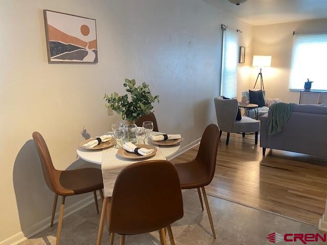 243 North Madison Street Cortez, CO 81321 - Photo 14 of 29 a view of a dining room with furniture and wooden floor