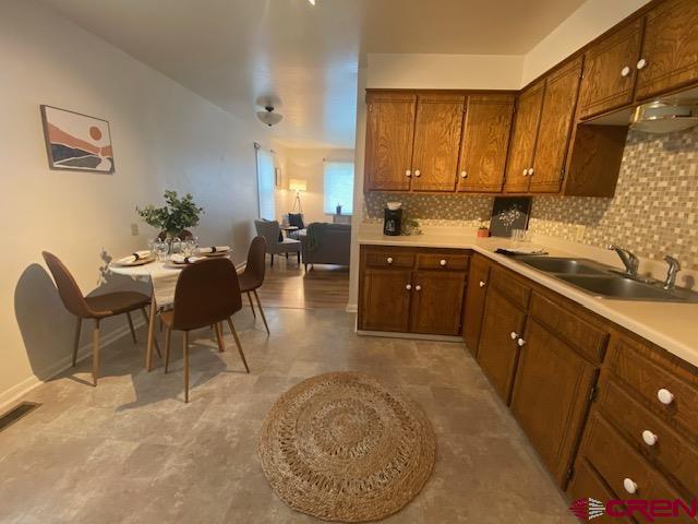 243 North Madison Street Cortez, CO 81321 - Photo 15 of 29 a kitchen with stainless steel appliances granite countertop sink stove and cabinets