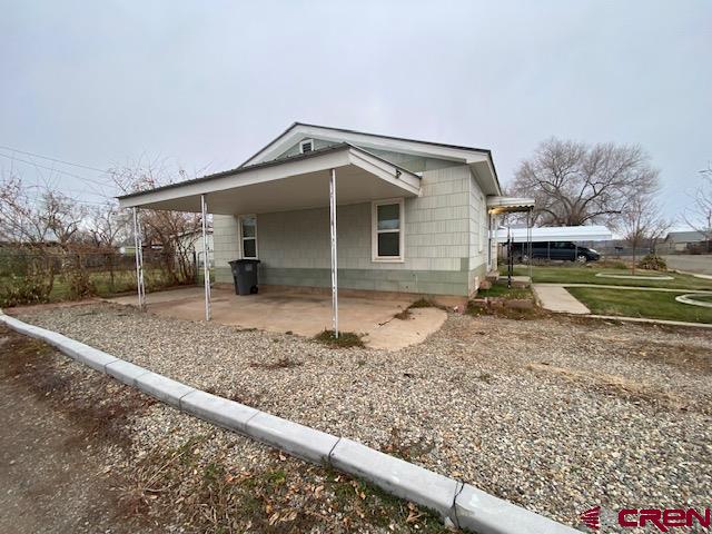 243 North Madison Street Cortez, CO 81321 - Photo 27 of 29 a view of a house with a yard