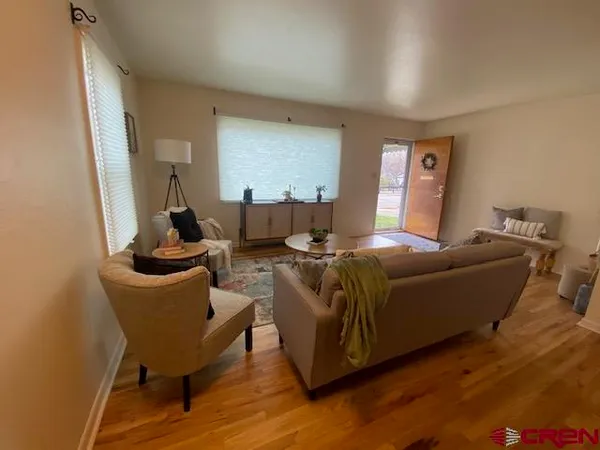 a living room with furniture and a window