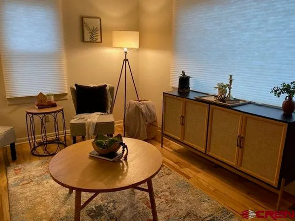 a view of a workspace with furniture