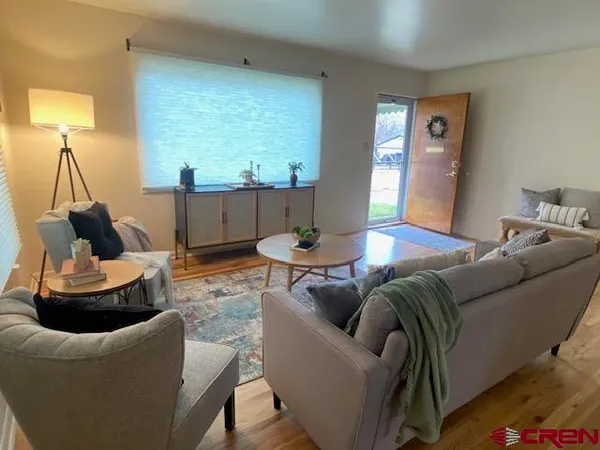 a living room with furniture and a large window