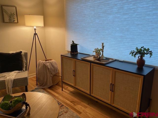 243 North Madison Street Cortez, CO 81321 - Photo 10 of 29 a bedroom with a bed and wooden floor