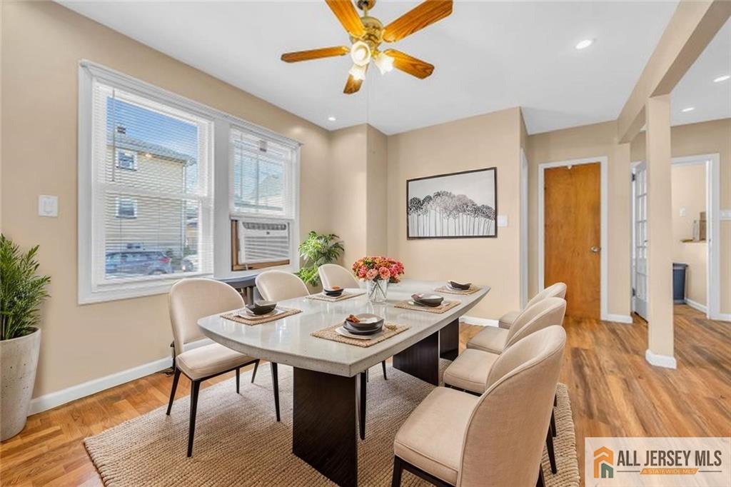 27 Charles Street Carteret, NJ 07008 - Photo 12 of 40 a view of a dining room with furniture window and wooden floor