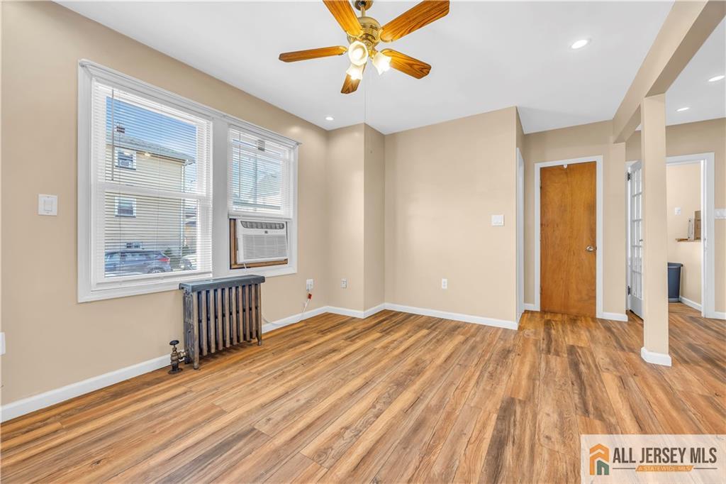 27 Charles Street Carteret, NJ 07008 - Photo 13 of 40 a view of a room with wooden floor and window