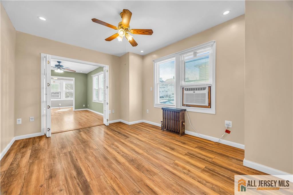 27 Charles Street Carteret, NJ 07008 - Photo 14 of 40 a bedroom with a bed and a large window