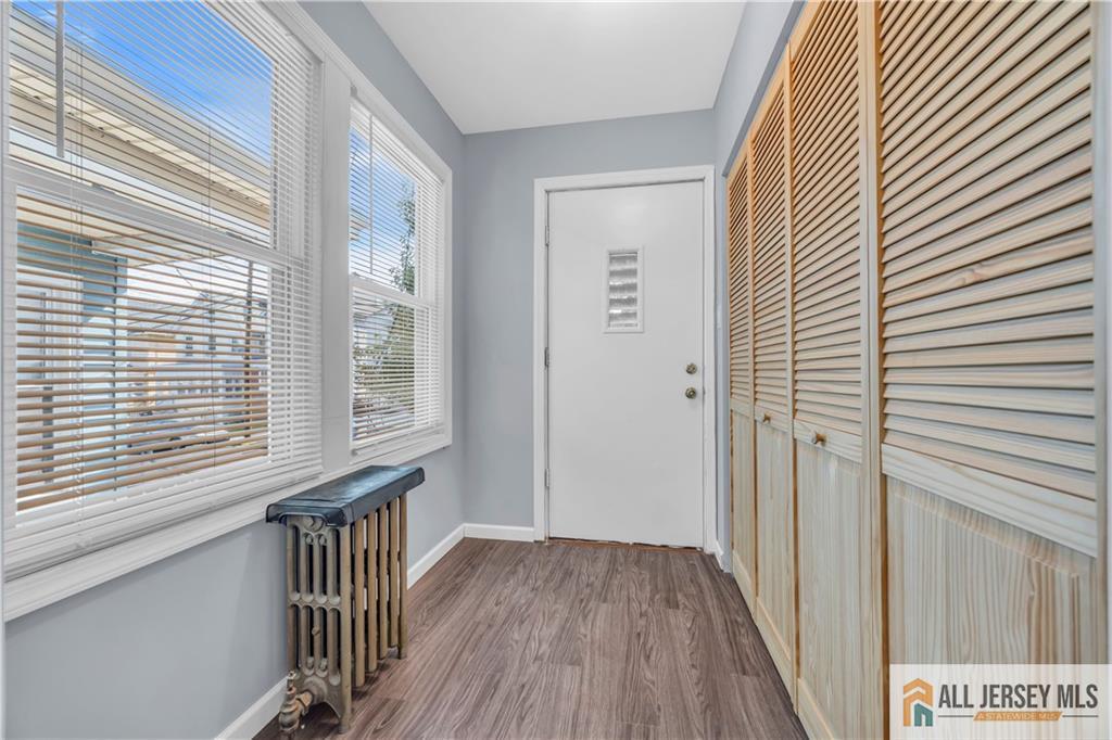 27 Charles Street Carteret, NJ 07008 - Photo 20 of 40 a view of a hallway with wooden floor and a window