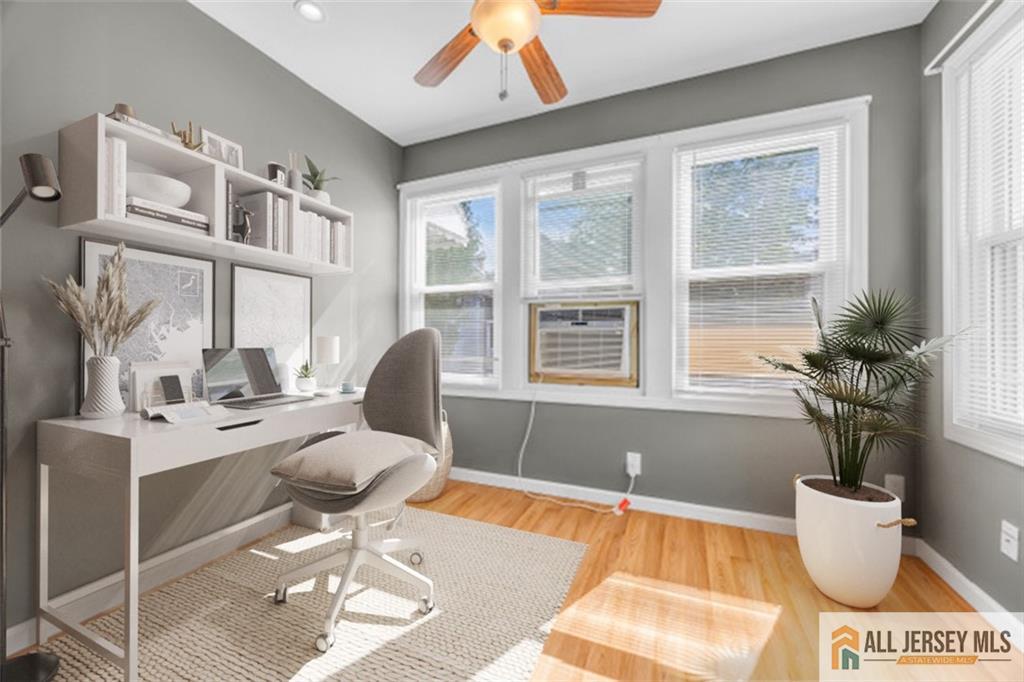 27 Charles Street Carteret, NJ 07008 - Photo 2 of 40 a living room with a large window and a table