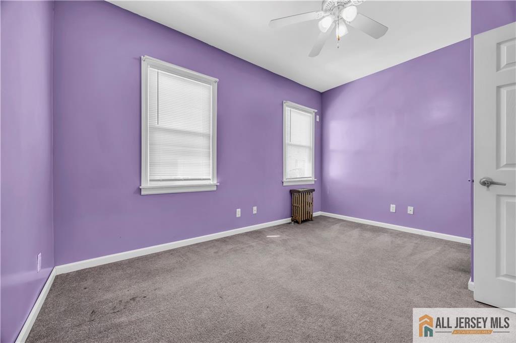 27 Charles Street Carteret, NJ 07008 - Photo 28 of 40 a view of an empty room with a window