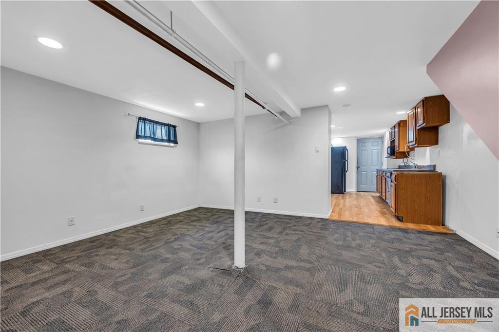 27 Charles Street Carteret, NJ 07008 - Photo 31 of 40 a view of a big room with a refrigerator