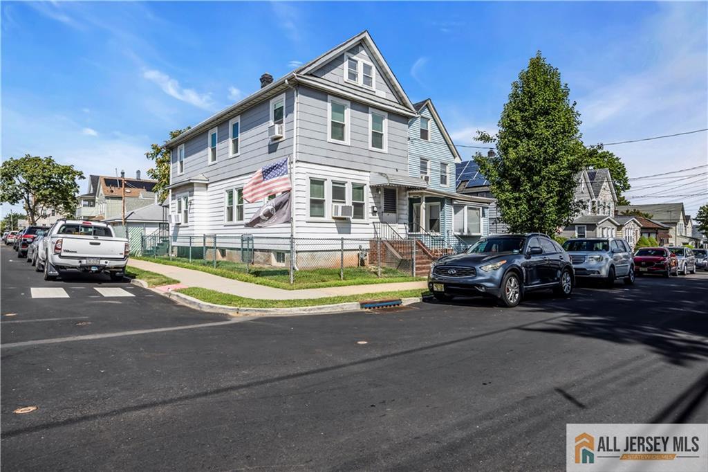 27 Charles Street Carteret, NJ 07008 - Photo 40 of 40 a front view of a building with cars parked
