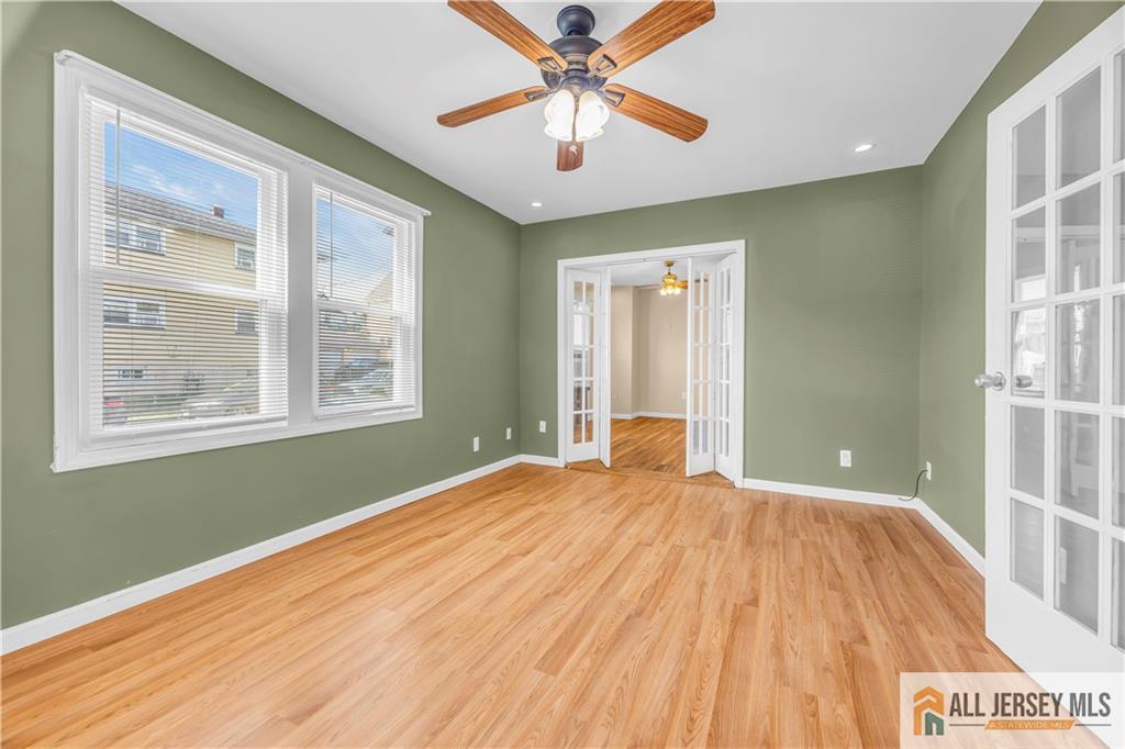 27 Charles Street Carteret, NJ 07008 - Photo 7 of 40 a bedroom with a bed and a window