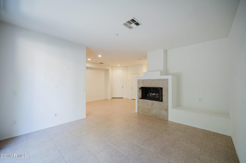 1454 Patricia Avenue, Unit 402 Simi Valley, CA 93065 - Photo 11 of 50 a view of an empty room with a fireplace