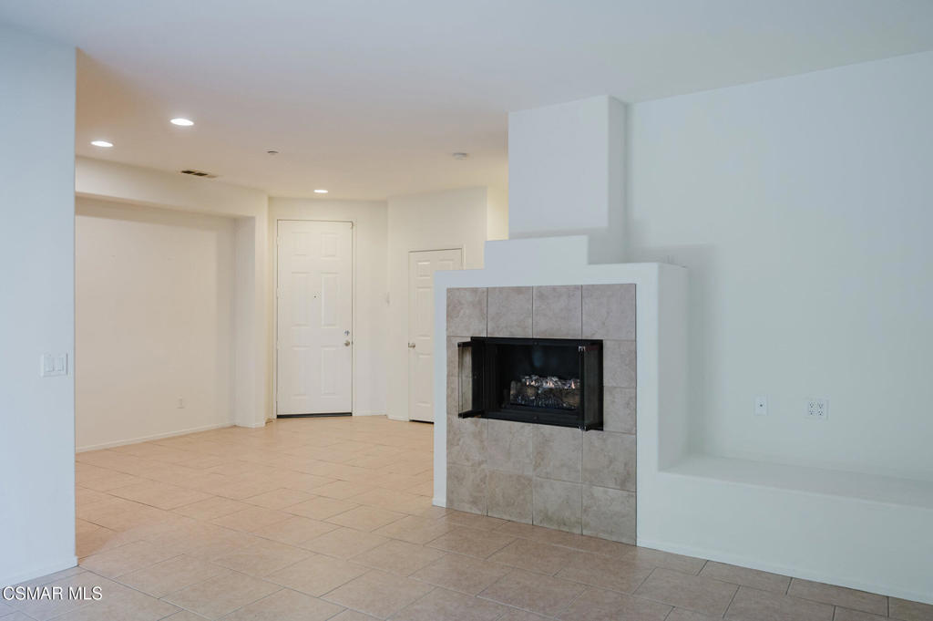 1454 Patricia Avenue, Unit 402 Simi Valley, CA 93065 - Photo 15 of 50 a view of an empty room with a fireplace