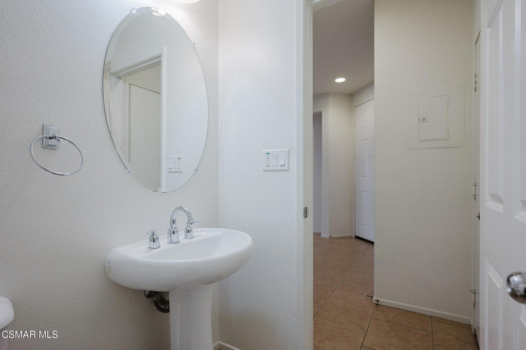 1454 Patricia Avenue, Unit 402 Simi Valley, CA 93065 - Photo 17 of 50 a bathroom with a sink and a mirror