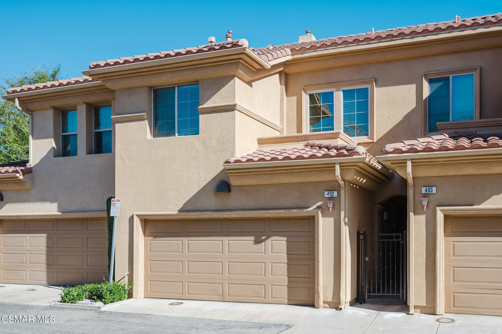 1454 Patricia Avenue, Unit 402 Simi Valley, CA 93065 - Photo 3 of 50 a view of a house with a street