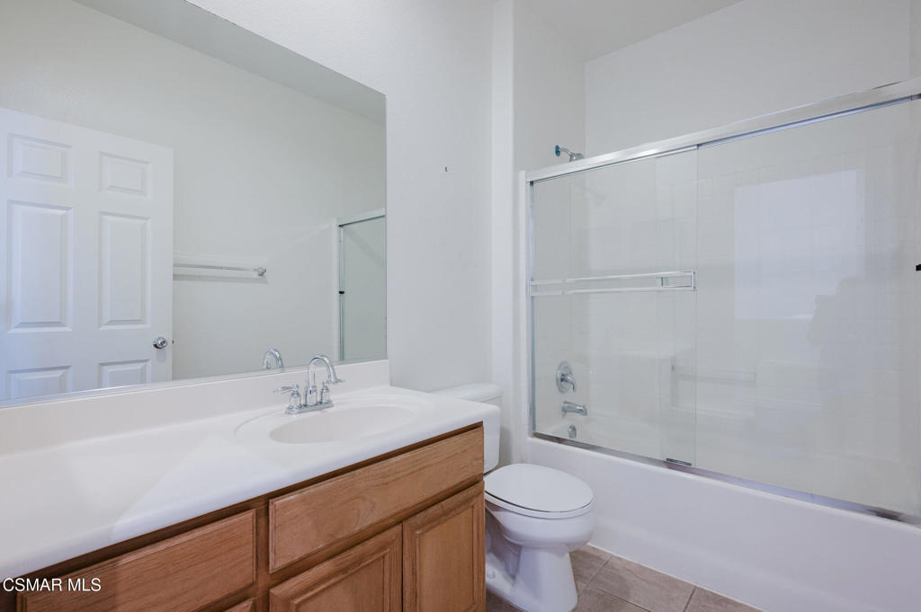 1454 Patricia Avenue, Unit 402 Simi Valley, CA 93065 - Photo 34 of 50 a bathroom with a sink toilet and shower