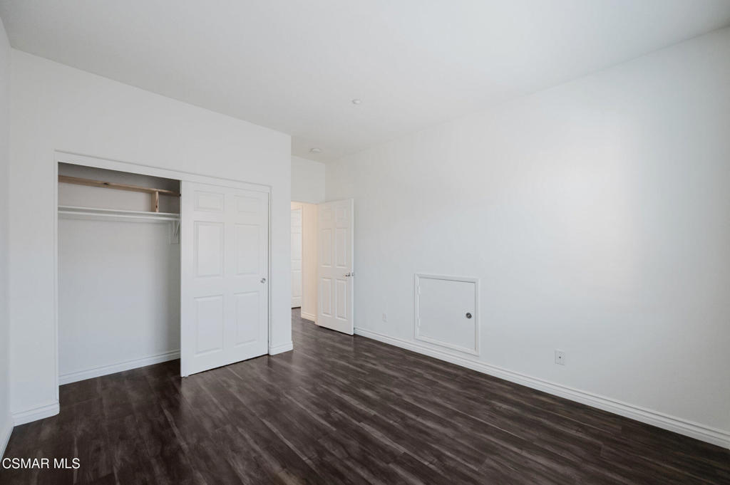 1454 Patricia Avenue, Unit 402 Simi Valley, CA 93065 - Photo 44 of 50 a view of an empty room with wooden floor