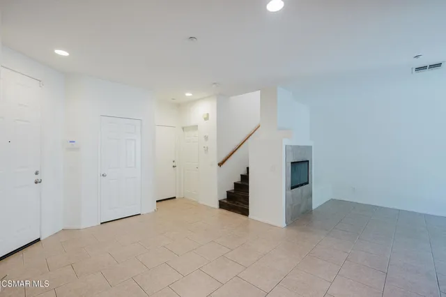 a view of an empty room with stairs
