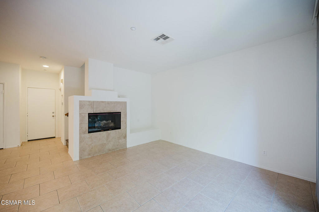 1454 Patricia Avenue, Unit 402 Simi Valley, CA 93065 - Photo 10 of 50 a view of an empty room with a fireplace