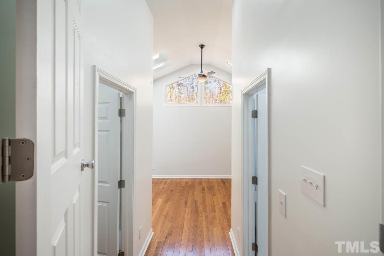 8 Holmes Circle Durham, NC 27713 - Photo 12 of 20 a view of a hallway with wooden floor