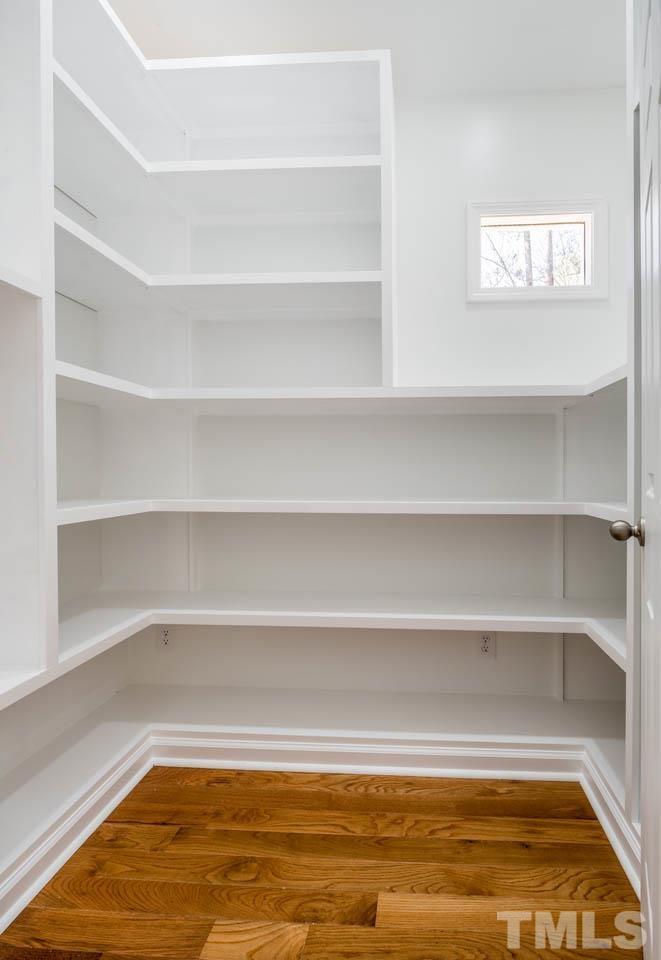 8 Holmes Circle Durham, NC 27713 - Photo 13 of 20 a view of a room with shelves