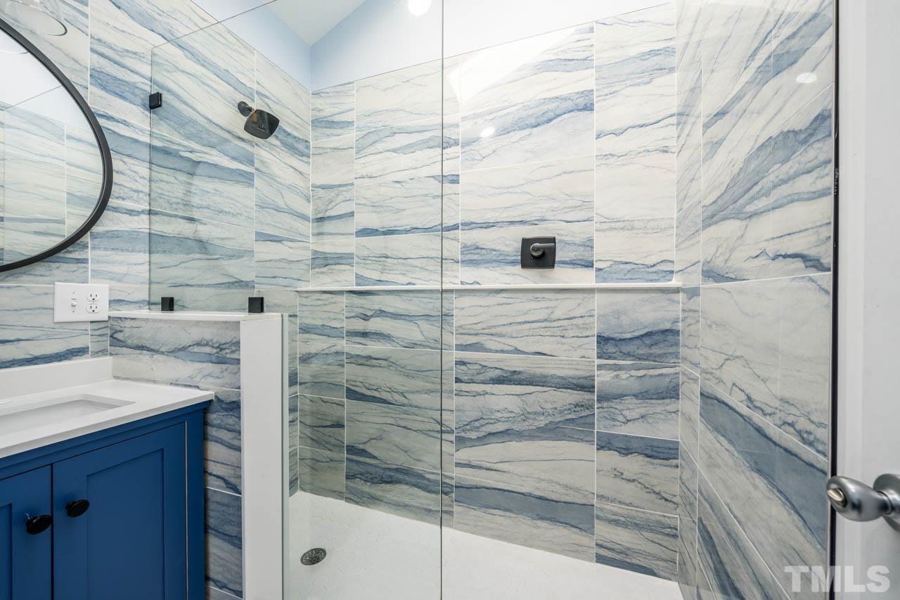 8 Holmes Circle Durham, NC 27713 - Photo 16 of 20 a bathroom with a shower and a sink