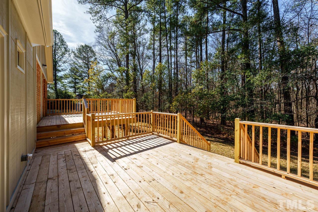 8 Holmes Circle Durham, NC 27713 - Photo 17 of 20 a view of balcony with wooden floor and fence