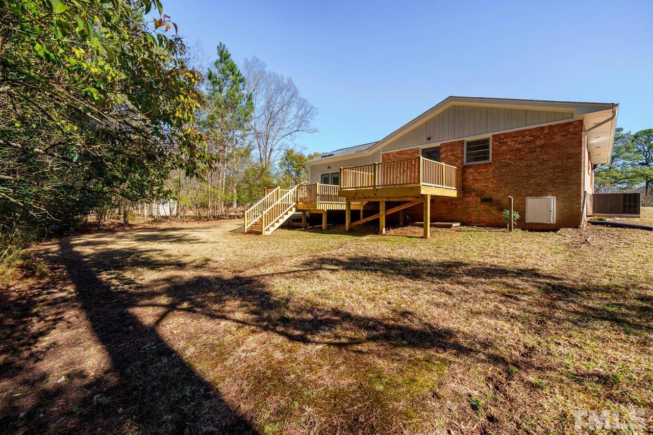 8 Holmes Circle Durham, NC 27713 - Photo 19 of 20 a front view of a house with a yard