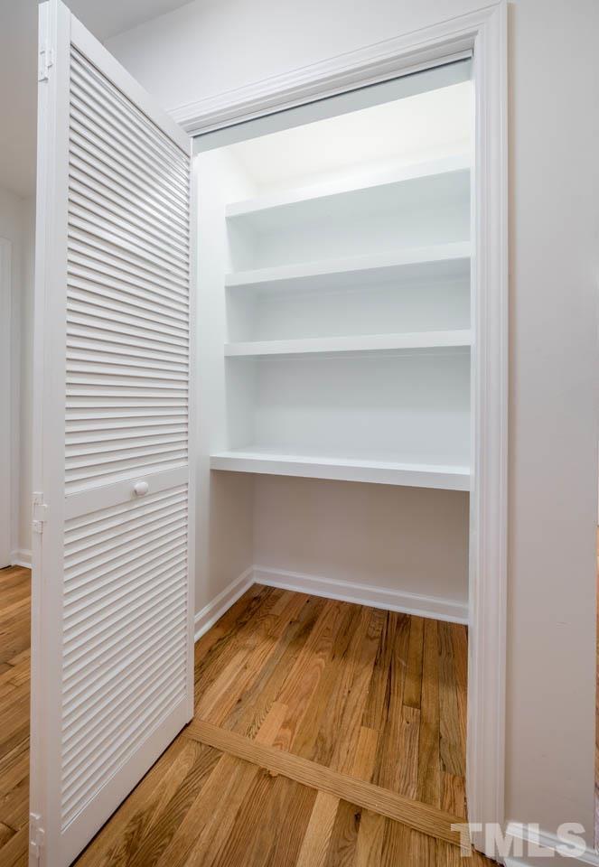 8 Holmes Circle Durham, NC 27713 - Photo 9 of 20 a view of walk in closet with empty racks