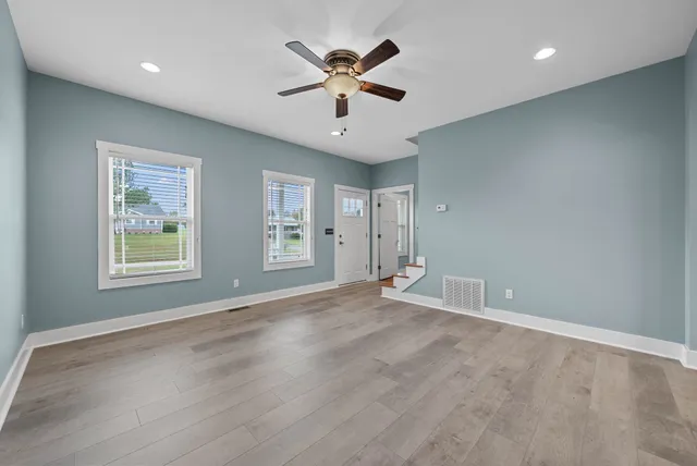 a view of an empty room with a window