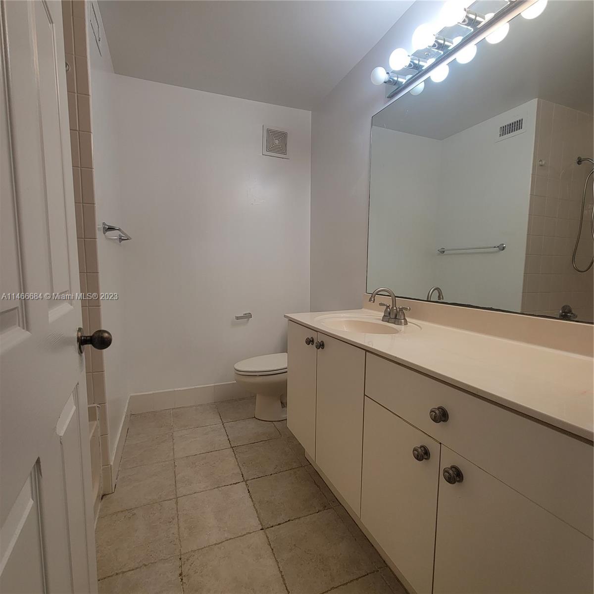 3883 Tree Top Drive Weston, FL 33332 - Photo 11 of 22 a bathroom with a sink a toilet and mirror