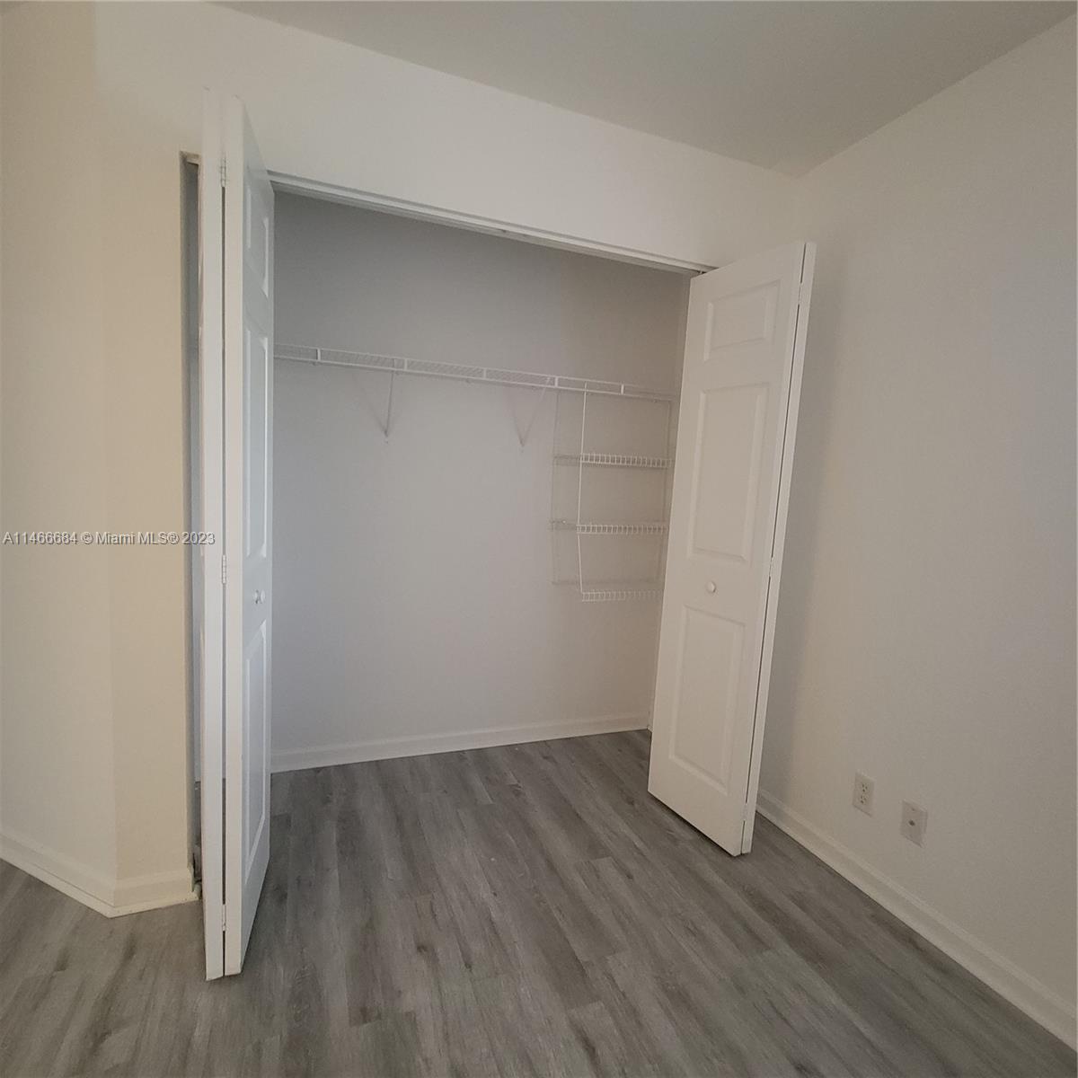 3883 Tree Top Drive Weston, FL 33332 - Photo 15 of 22 a view of small space with wooden floor