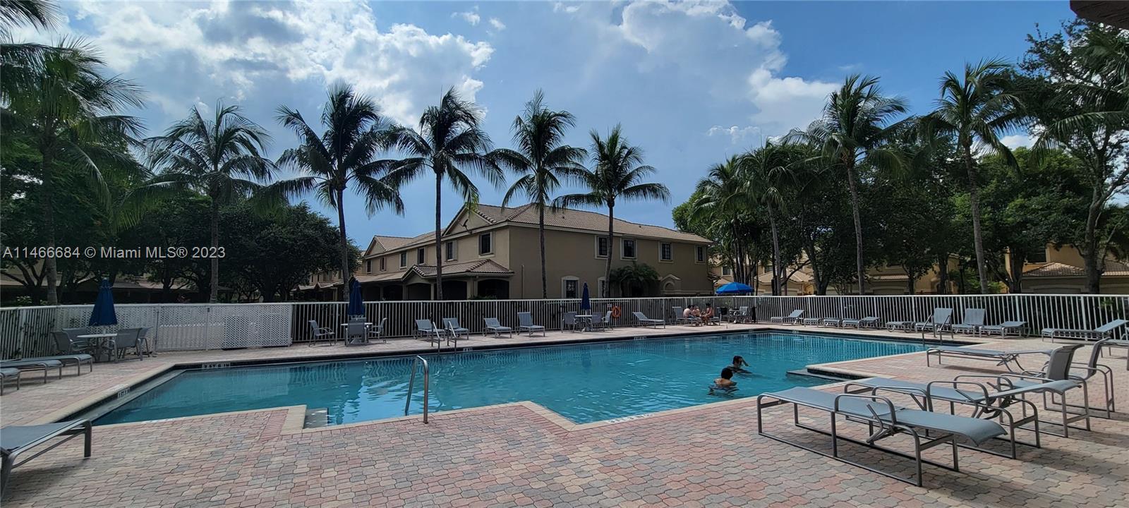 3883 Tree Top Drive Weston, FL 33332 - Photo 21 of 22 a swimming pool with outdoor seating yard and barbeque oven
