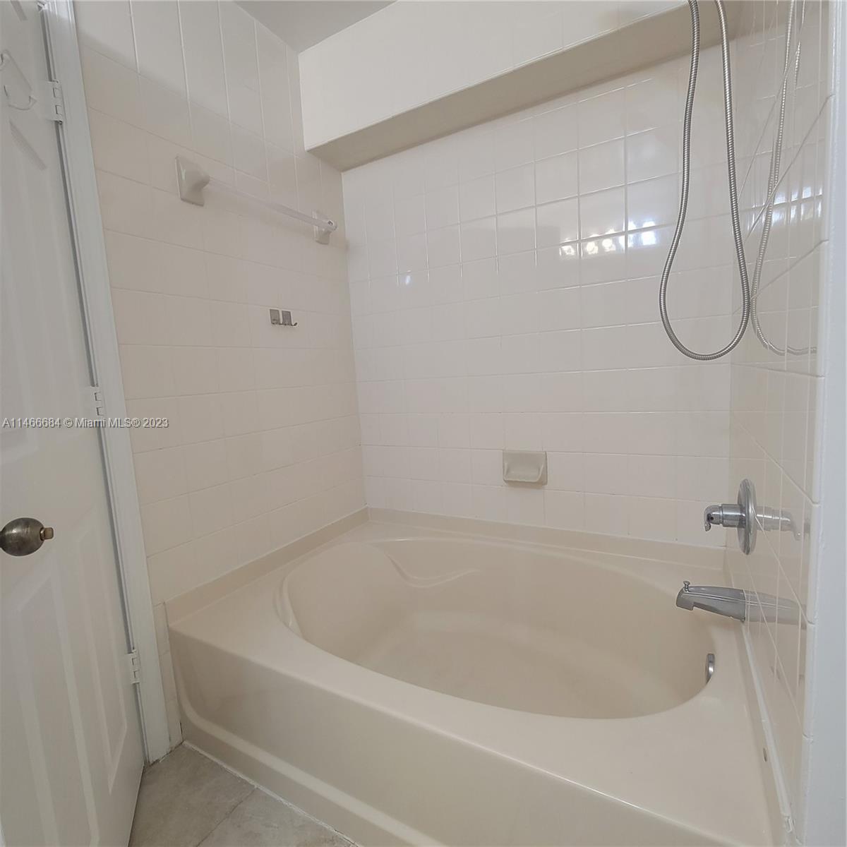 3883 Tree Top Drive Weston, FL 33332 - Photo 10 of 22 a close view of a bathtub in bathroom